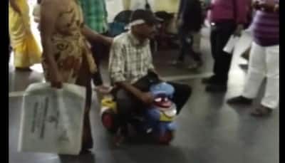 Denied wheelchair, patient forced to use son's toy cycle to reach hospital ward