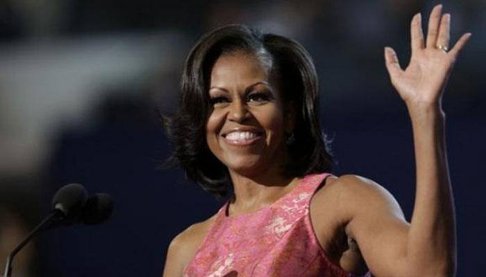 THIS PIC of Michelle Obama sporting her natural hair is setting internet of fire!