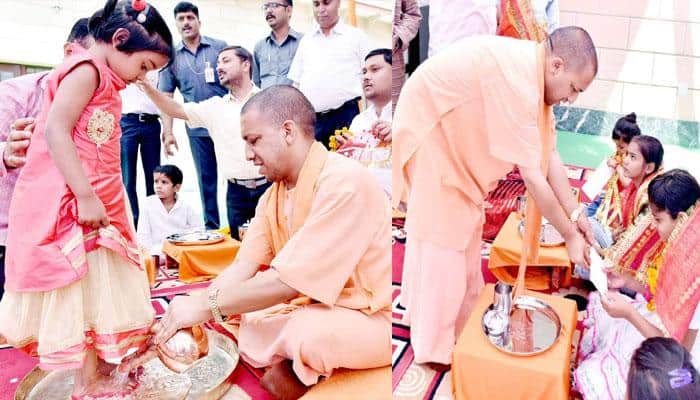 Yogi Adityanath washes little girl&#039;s feet during &#039;Kanya Pujan&#039; ritual; social media loving the picture!
