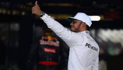 Chinese Grand Prix: Mercedes' Lewis Hamilton romps to pole position