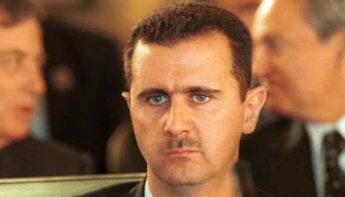 Britain urges Vladimir Putin to end support for 'toxic'  Syrian President Assad