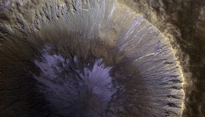 NASA shares beautiful winter's view of gullied crater on Martian surface