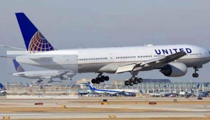 United Airlines reaches settlement with Asian man dragged off from flight
