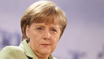 Angela Merkel makes rare Russia visit as Vladimir Putin backs warmer ties