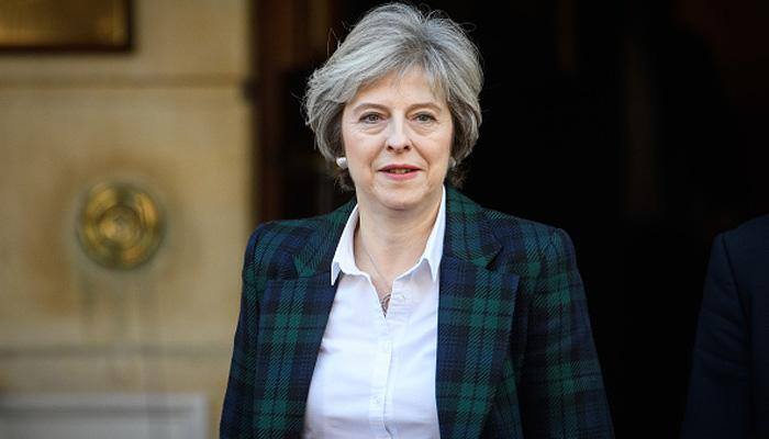 UK PM May plays up "bloody difficult woman" image after Juncker dinner reports