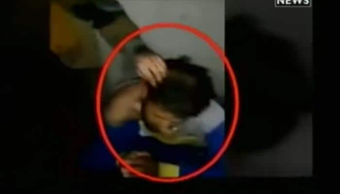 Terrorists insult J&amp;K cop, tonsure his head on charges of spying - Watch Video