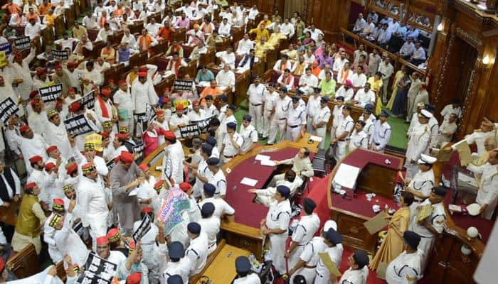 Stormy start to UP Assembly session; SP, BSP MLAs stage protest, throw paper balls at Governor