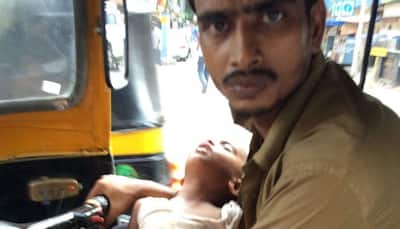 This man drives auto with his kid in lap as wife is paralysed; pic goes viral, many come forward for help