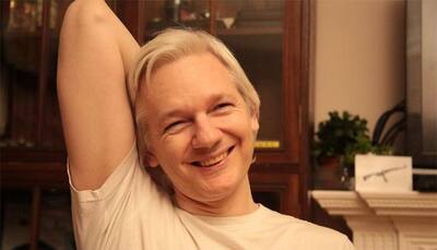 Sweden drops Assange investigation, UK police says he still faces arrest