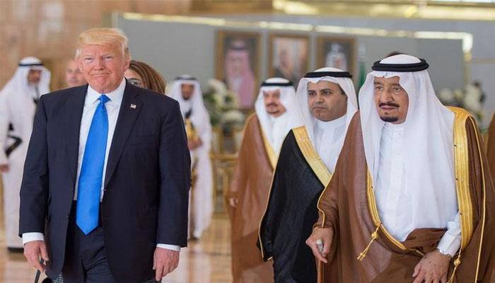 Under siege in Washington, Donald Trump reaps Saudi arms deal, stronger ties