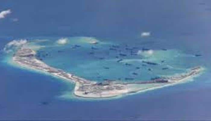 US Navy ship sails near South China Sea reef claimed by Beijing: US official