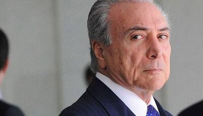 Brazil's  Michel Temer wins victory in bid to keep power for now