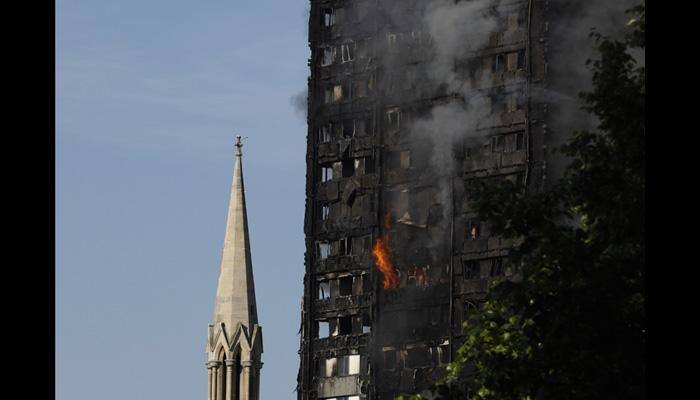 London fire: baby dropped from 10th floor caught by man on ground