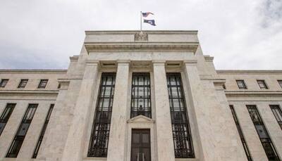 US Fed hikes key rate to 1.0-1.25%, gives details on balance sheet reduction