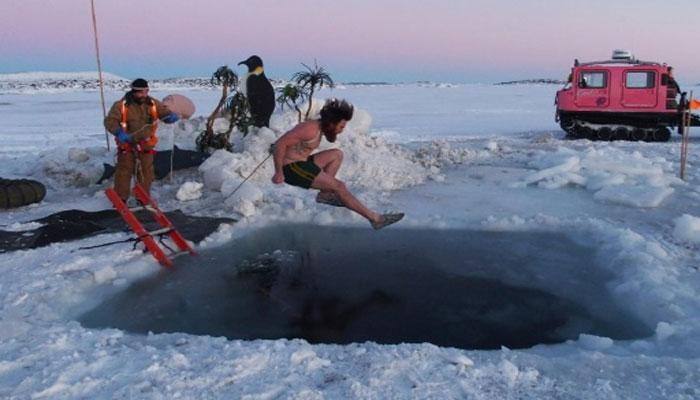 Antarctic researchers take icy plunge to mark solstice