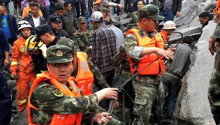 China landslide leaves six dead, over 100 missing