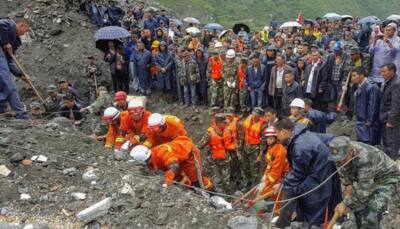 Hopes fading in China for 118 still missing day after landslide