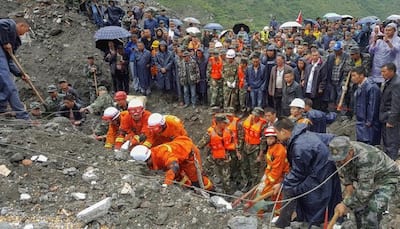 Hopes fade in China as more landslide victims found with 93 missing
