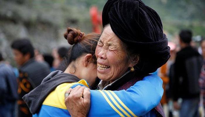 Villagers begin to mourn dead after deadly China landslide