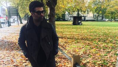 What are Karan Johar's cryptic messages hinting at?