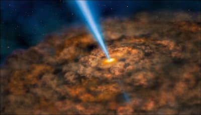 In a first, astronomers discover orbiting supermassive black holes