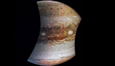 Here's looking at you, kid! Check out Jupiter's 'face' peering down at Juno – See pic