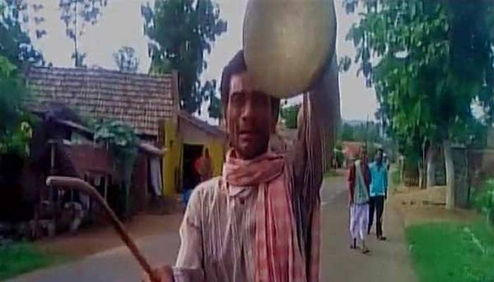 Man forced to play gong around 13 villages as wife didn't cast vote in Sarpanch's favour; 52 people booked