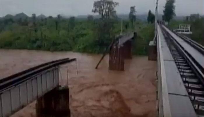 Raging flood waters wash away massive rail bridge in Odisha&#039;s Rayagada - WATCH