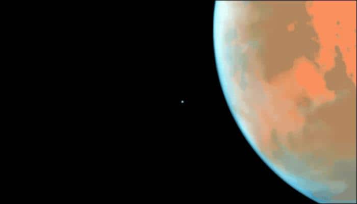 NASA&#039;s Hubble captures Mars&#039; tiny moon Phobos photobombing the Red Planet! - Watch video