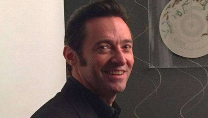 Hugh Jackman checks his children's phones