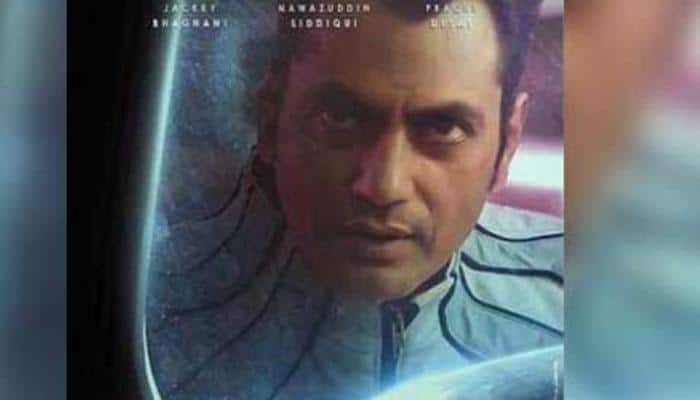 Nawazuddin Siddiqui looks out of the glass in &#039;Carbon&#039;