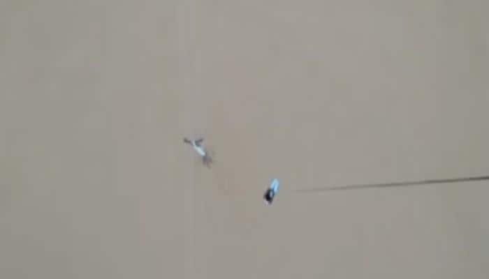 Gujarat floods: This is how IAF helicopter rescued a man clinging to electric pole – Watch video