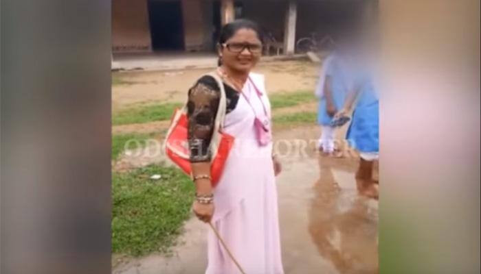 Viral video: Odisha teacher, standing with stick, makes students clean her scooter — Watch 