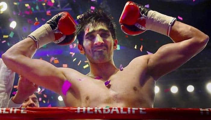 Vijender Singh defeats China&#039;s Zulpikar Maimaitiali by unanimous decision in Battleground Asia