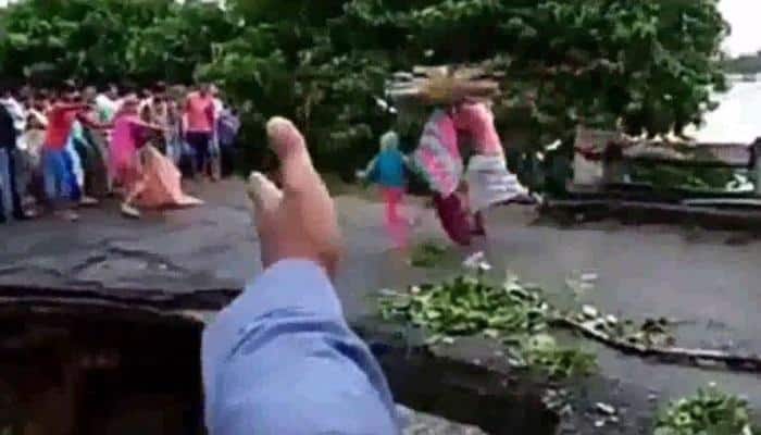 Bihar floods: Family of three washed away in bridge collapse | Watch video