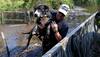 Harvey's floods hang on in Texas, complicating rescue efforts