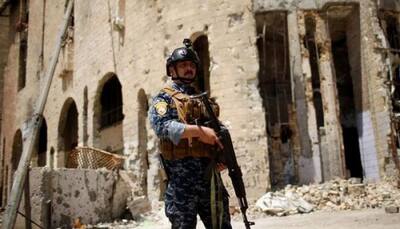 Suicide bombers armed with grenades kill 7 in Iraq
