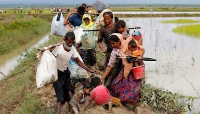 Thousands more Rohingya refugees flee Myanmar by land, sea