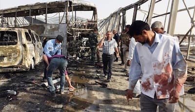 Suicide attacks on restaurants, checkpoint, kill 60 in southern Iraq
