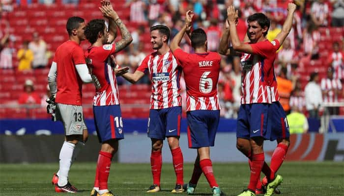 Atletico Madrid second as Yannick Carrasco, Antoine Griezmann strikes down Sevilla