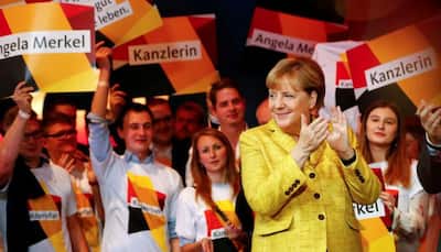Angela Merkel hopes to create history as Germany votes today