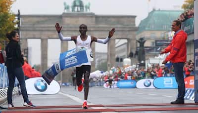 Eliud Kipchoge wins rainy Berlin marathon, misses world record