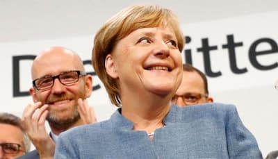 Vote winner Angela Merkel faces tricky coalition talks, hard-right 'earthquake'