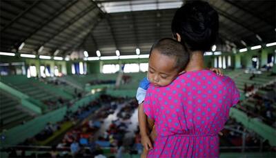 More than 120,000 flee rumbling Bali volcano