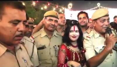 Radhe Maa sings and dances with Delhi cops - Watch