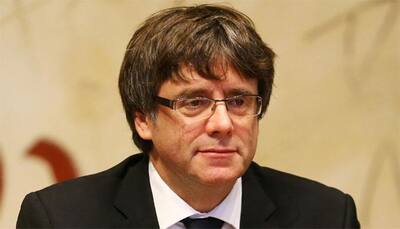 Catalan leader proclaims independence but suspends it pending talks