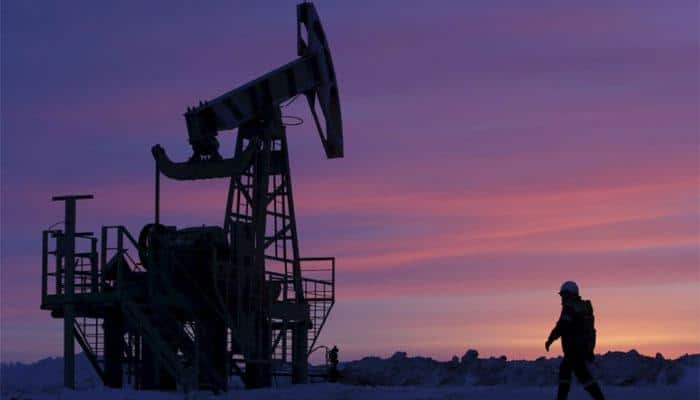 Oil up on signs of tighter market, but 2018 looks more uncertain