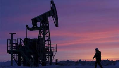 Oil up on signs of tighter market, but 2018 looks more uncertain