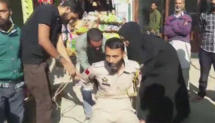 J&amp;K: Cop tied to chair, beaten up for clicking pics of woman
