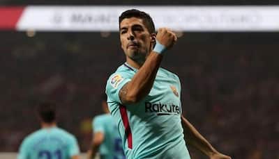 Luis Suarez earns Barcelona point at Atletico Madrid